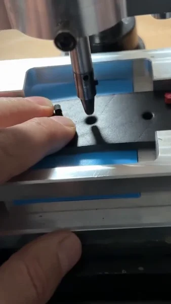 Punching belt holes using a jig in the Variani atelier